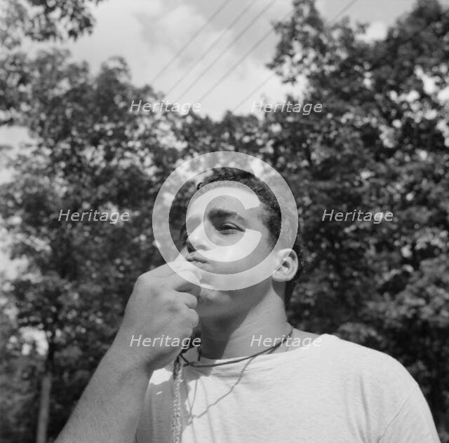 The town crier, Danny Poocchiari., Camp Nathan Hale, Southfields, New York, 1943 Creator: Gordon Parks.