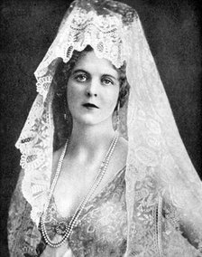 Woman wearing a lace mantilla, Andalusia, Spain, 1936. Artist: Fox