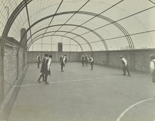 Girls playing netball on a roof playground, Barrett Street Trade School, London, 1927. Artist: Unknown.