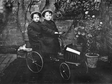 Two boys in a pedal car, (early 20th century?). Artist: Unknown