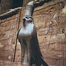 Sculpture of the god Horus at the Edfu temple entrance in Egypt.