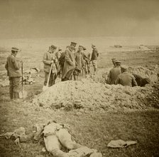 Burying bodies, Sainte-Marie-à-Py, northern France, c1914-c1918.  Artist: Unknown.