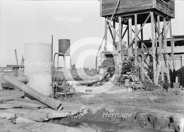 Pumping plant for irrigation powered by a natural gas engine, Tulare County, California, 1938. Creator: Dorothea Lange.