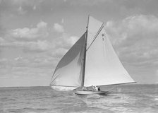 'Norman' (H1), an early 8 Metre class yacht sailing downwind, 1911. Creator: Kirk & Sons of Cowes.