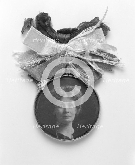 A silver and glass badge with a medallion portrait of Emmeline Pankhurst, c1908. Artist: Unknown