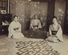 Japanese servants O Hero San, O Eun San, and O Sok San with tea utensils in the..., 1899. Creator: Eleanor Lord Pray.
