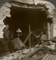 The damage done by a German Zeppelin bomb, World War I, 1914-1918.Artist: Realistic Travels Publishers