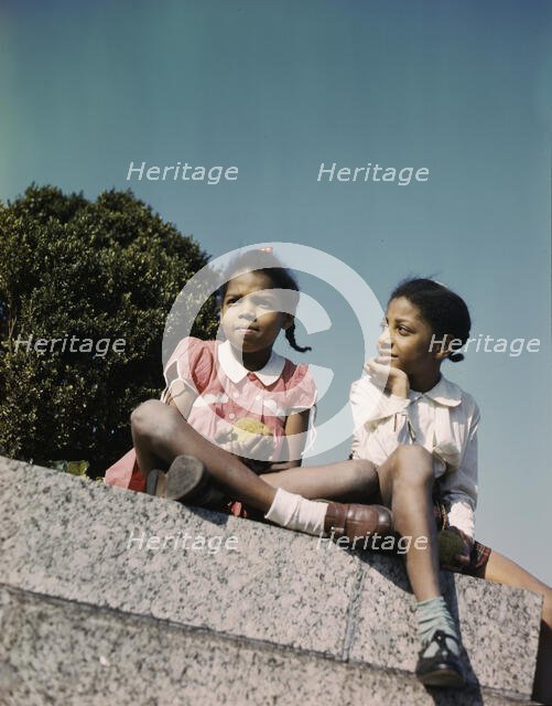 Two little girls in a park near Union Station, Washington, D.C., ca. 1943. Creator: Unknown.
