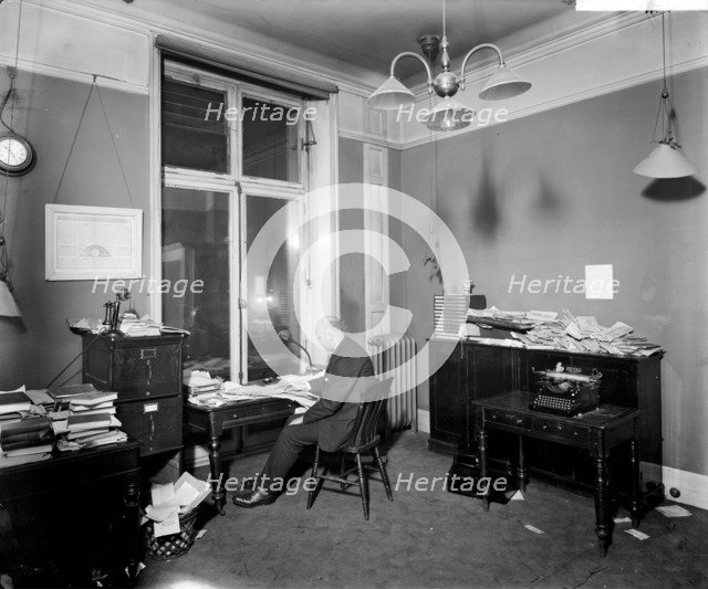 An editor working late in the Morning Post offices at Inveresk House, Westminster, London, 1920. Artist: Bedford Lemere and Company
