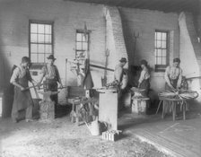 Pa. - Carlisle Indian School - student wheelwrights working in shop, 1901. Creator: Frances Benjamin Johnston.