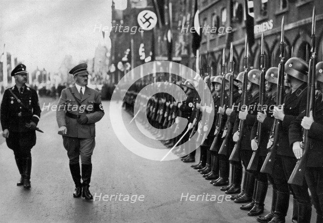 Adolf Hitler reviewing Leibstandarte troops at the Nuremberg Rally, Germany, 1935. Artist: Unknown