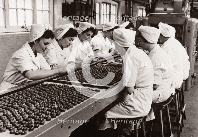 Decorating chocolates by hand, Rowntree factory, York, Yorkshire, 1956. Artist: Unknown