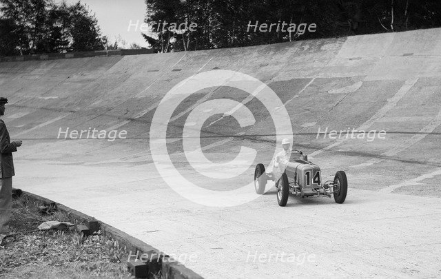 Raymond Mays' ERA on the way to second place, JCC International Trophy, Brooklands, 7 May 1938.  Artist: Bill Brunell.