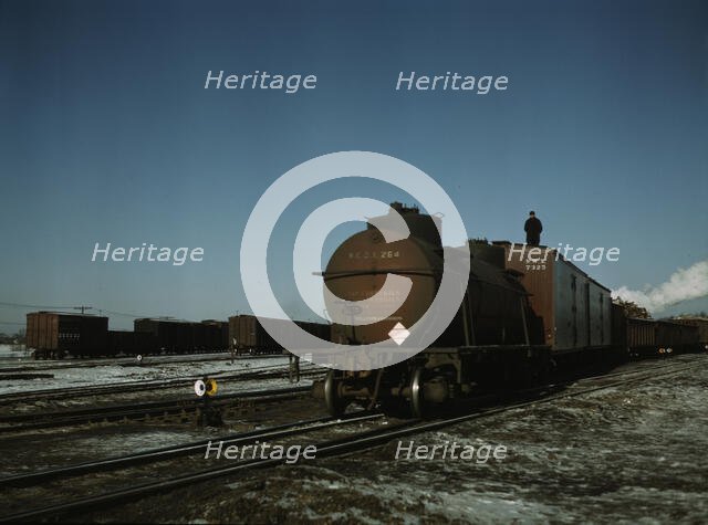 A train (or "cut") being pushed out of a receiving..., Proviso yard, C & NW RR., Chicago, Ill., 1942 Creator: Jack Delano.