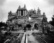 Ferdinand Cheval in front of his Palais Idéal, c. 1890. Creator: Anonymous.