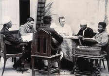 A group of men taking notes at a table, during a plague epidemic in Mandalay, 1906. Creator: Unknown.