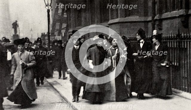 Emmeline Pankhurst, British suffragette leader, carrying a petition, London, 13 February 1908. Artist: Unknown