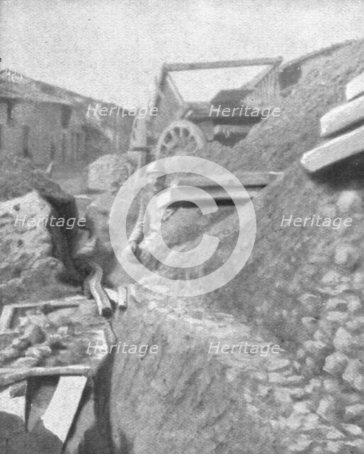 'Le Champ de Bataille; L'entrée de Cumieres, a l'Est du Mort-Homme, defendue..., 1916 (1924) Creator: Unknown.