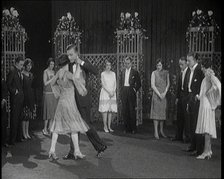 A Group of People Dancing the Charleston. One Female Civilian is Rubbing Her Legs is Pain, 1926. Creator: British Pathe Ltd.