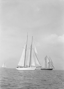'Westward' (foreground) and the visiting Canadian schooner 'Bluenose', 1935. Creator: Kirk & Sons of Cowes.