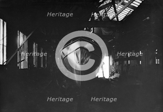 Egyptian motor launch in shed, 1911. Creator: Kirk & Sons of Cowes.