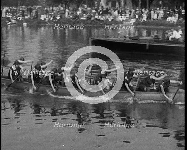 Young Female Civilians Wearing a Team Sport Outfit in a Rowing Race, an Audience Is Seen on..., 1920 Creator: British Pathe Ltd.