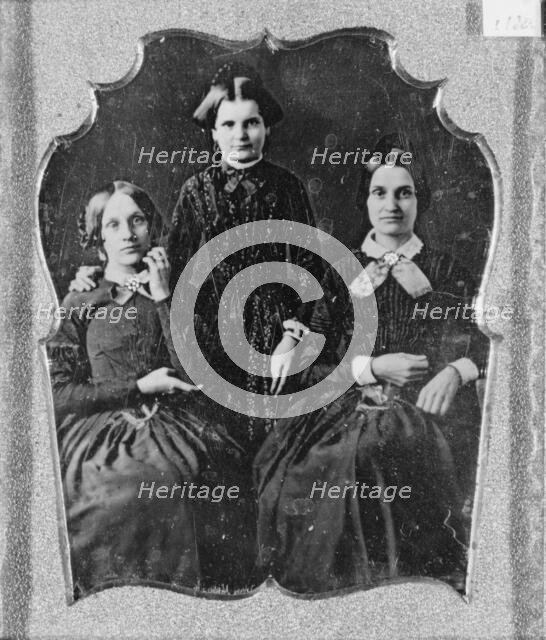 Three unidentified women, two seated, one standing, facing front, between 1840 and 1860. Creator: Unknown.