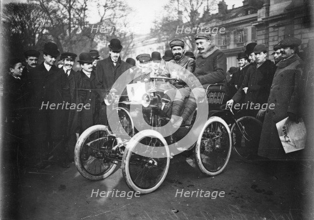 Louis Renault in the driver's seat of a Voiturette Renault 1¾ hp, 1899. Artist: Unknown