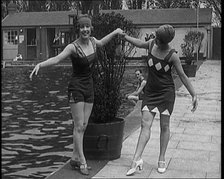 Two Young Female Civilians Wearing Short Swimsuits and Heeled Shoes Posing for the Camera..., 1920. Creator: British Pathe Ltd.