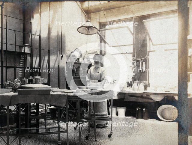 St Bartholomew's Hospital, London: nurse in operating theatre, c1890. Creator: Unknown.