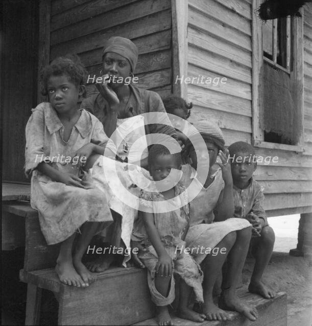Turpentine worker's family near Cordele, Alabama, 1936. Creator: Dorothea Lange.