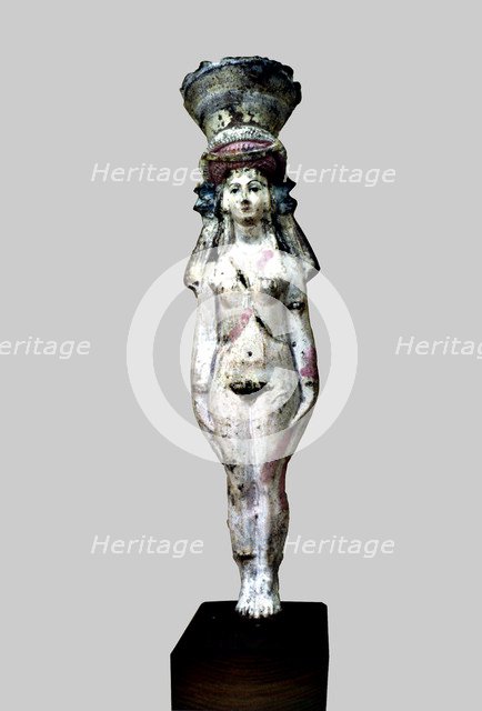 Statuette identified as Hathor - Aphrodite, made in painted terracotta.