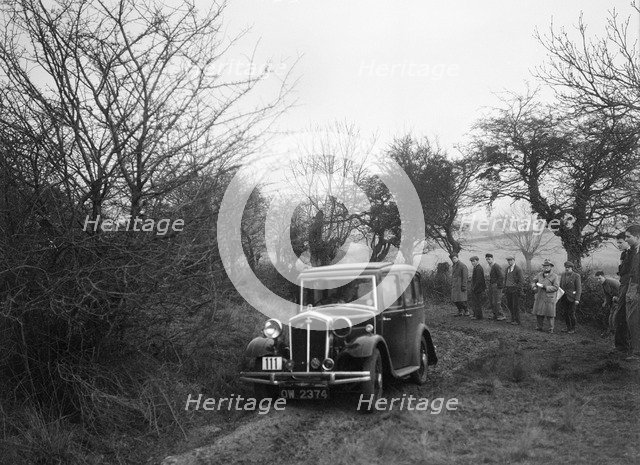 Wolseley of LL Hunt at the Sunbac Colmore Trial, near Winchcombe, Gloucestershire, 1934. Artist: Bill Brunell.
