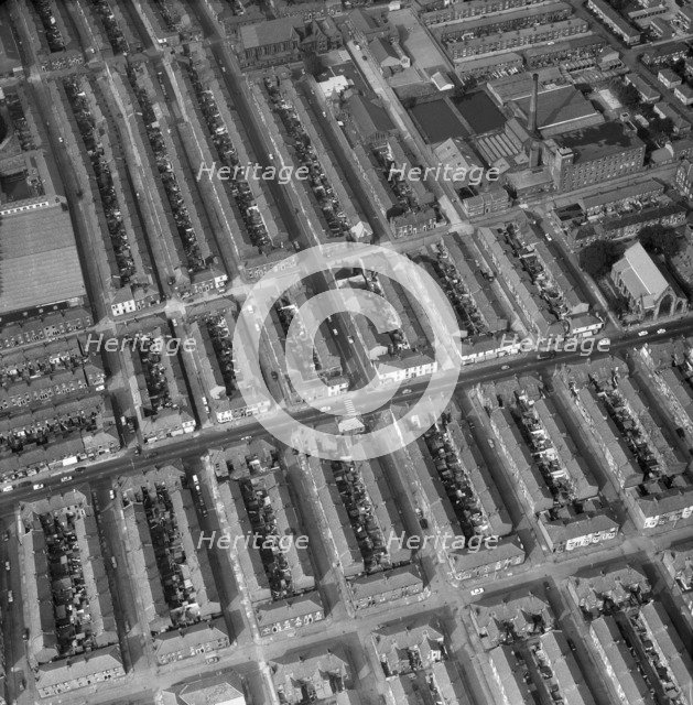 Aerial view of terraced houses, a mill and a church, Preston, Lancashire, 1971. Artist: Aerofilms.