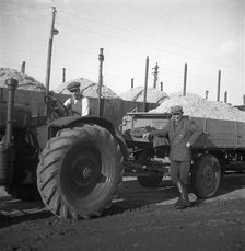 Tractors and loaded trailers at the sugar mill in Arlöv, Scania, Sweden, c1940s(?). Artist: Otto Ohm