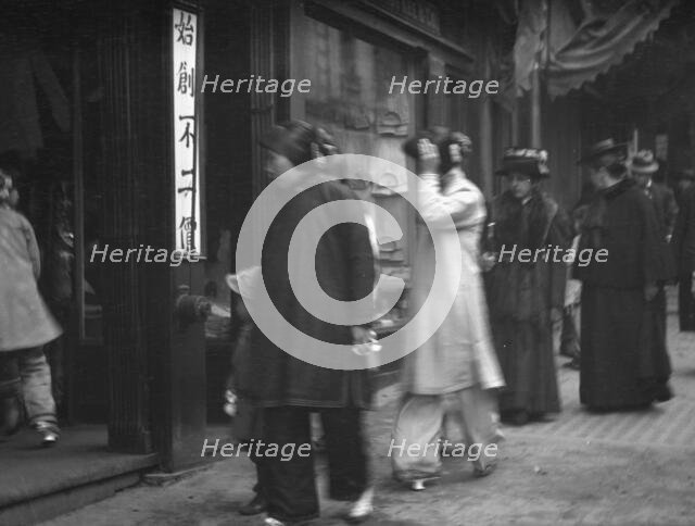 Chinese and American women walking down a street, Chinatown, San Francisco, between 1896 and 1906. Creator: Arnold Genthe.