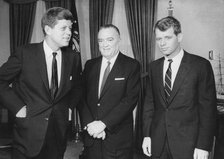 President John F. Kennedy with J Edgar Hoover and Robert F. Kennedy, c1960s. Artist: Unknown