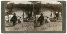 Baptising in the River Jordan, Palestine, 1903.Artist: Underwood & Underwood