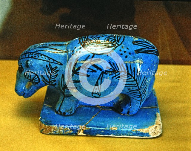 Hippo, blue glazed ceramic figurine, side view.