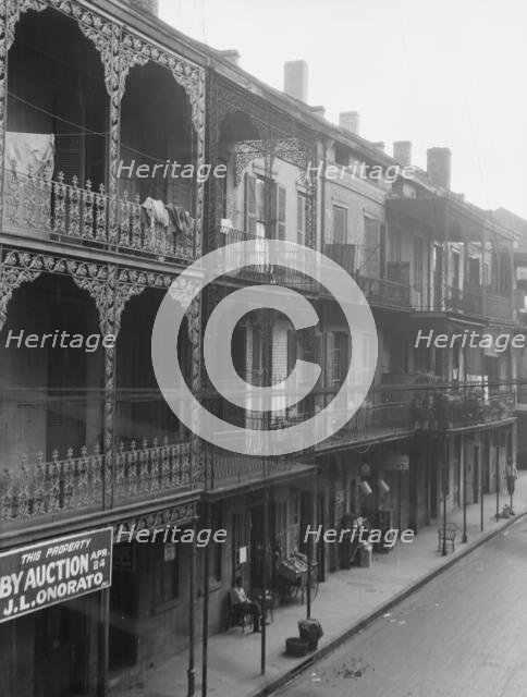 View down a street, New Orleans, between 1920 and 1926. Creator: Arnold Genthe.