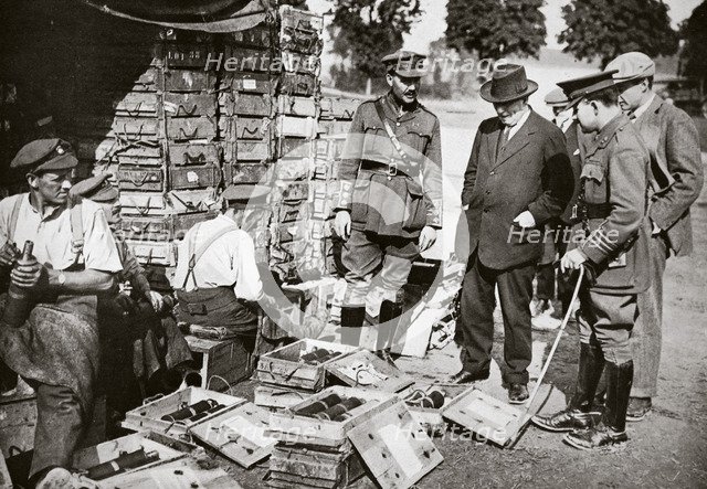 Mr Asquith watching men adjusting fuses, Somme campaign, France, World War I, 1916. Artist: Unknown