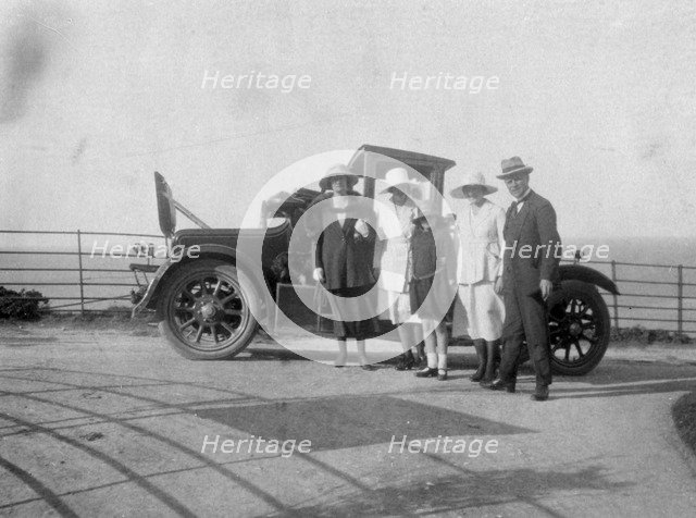 A group of people in front of their car at the seaside, c1920s(?). Artist: Unknown