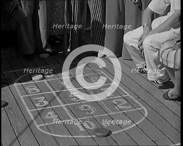 People Enjoying Games on Deck of a Cruise Liner Whilst at Sea, 1931. Creator: British Pathe Ltd.