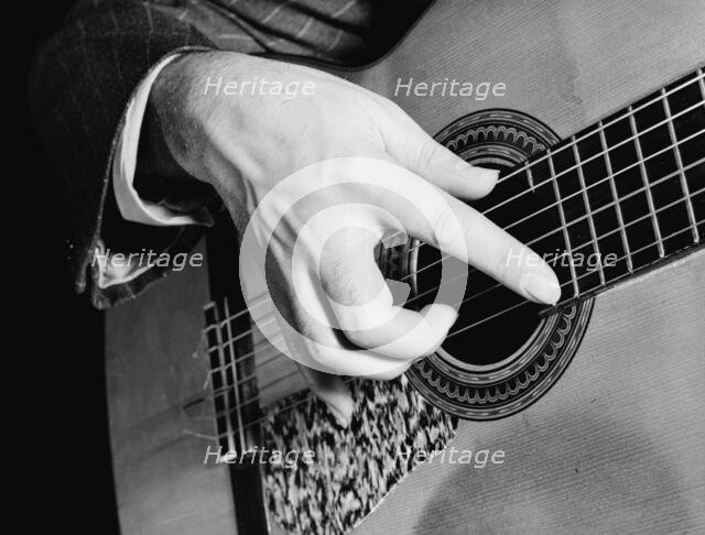 Portrait of Vincente Gomez, Café Society Uptown(?), New York, N.Y., ca. June 1946. Creator: William Paul Gottlieb.
