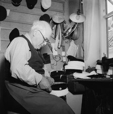 A hatter making a cap, Landskrona, Sweden, 1949. Artist: Unknown