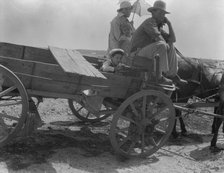 Drought-stricken farmer and family near Muskogee, Oklahoma, 1936. Creator: Dorothea Lange.