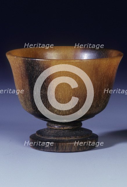 Plain circular rhino horn cup with turned stepped foot and stem, Qing dynasty, China, 18th century. Artist: Unknown