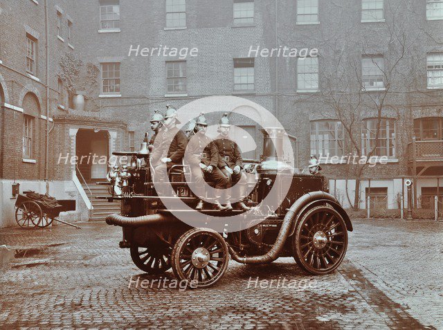 Firemen aboard a motor steamer, London Fire Brigade Headquarters, London, 1909. Artist: Unknown.