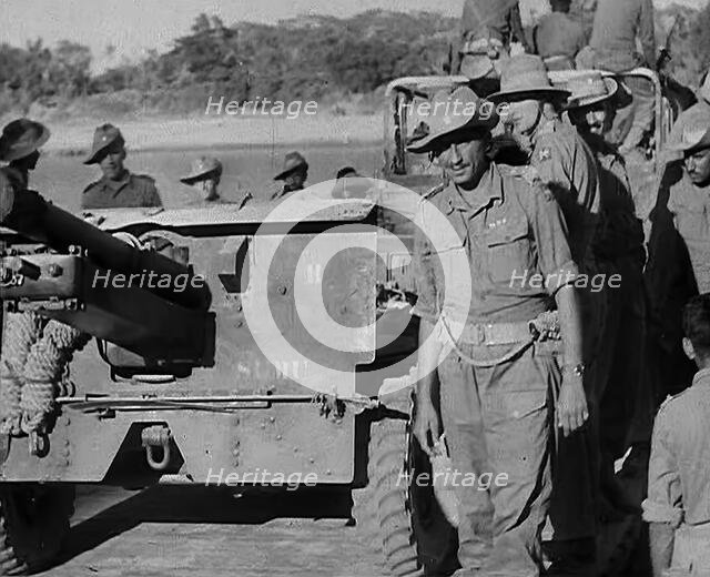 Troops Standing by an Artillery Gun on ‘Grub Bridge’, 1943. Creator: British Pathe Ltd.