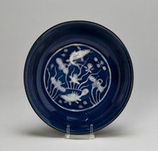Dish with Fish Swimming in Lotus Pond, Ming dynasty (1368-1644), Wanli reign (1573-1620). Creator: Unknown.